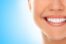 Smiling person with bright teeth, concept of dental health and treatments like periodontal surgery and gum contouring.